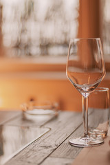 Wine glass in a restaurant closeup, warm and elegant