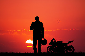 Fototapeta na wymiar Man with motorbike at sunset
