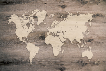 World map on wooden planks background