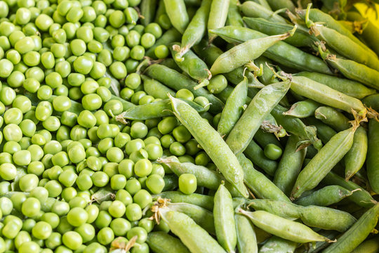 Flat lay pile of fresh green peas closeup macro