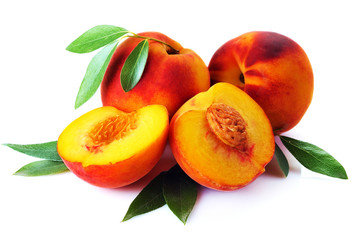 Fresh peach with green leaf isolated on white background.