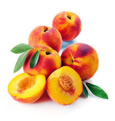 Fresh peach with green leaf isolated on white background
