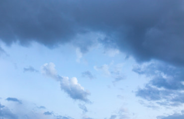 Beautiful clouds at sunset after rain as background .