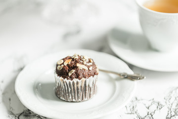 Chocolate muffins with banana and tea