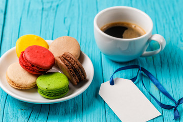Dessert macaroon, cup of coffee