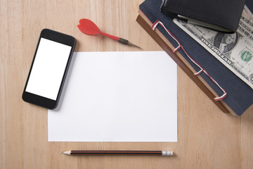 Blank smart phone with paper note and pencil on wooden table ready for input the text.