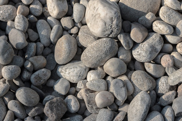 Perpendicular photo of white river pebbles