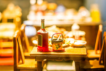 close up Miniature clay figurine Thailand's floating market,Miniature boat carrying tropical fruit on wood background