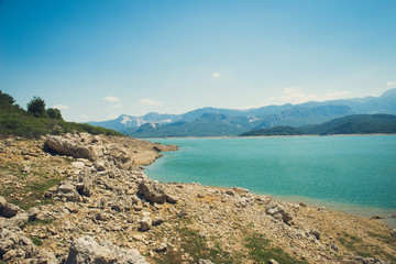 rocky coast of the mountain lake