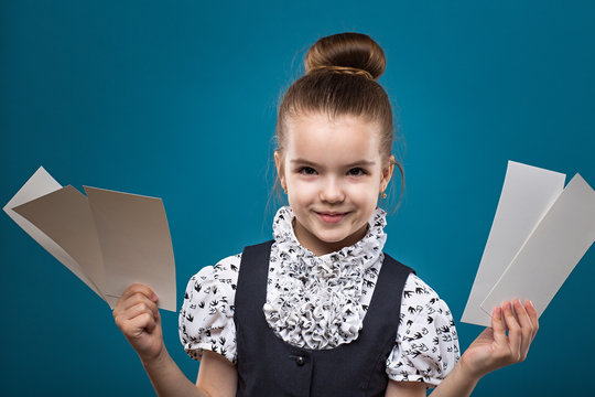 Little Child With Papers Dressed Like Teacher