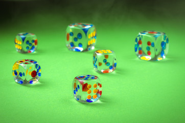 cubes dicing on a green background/cubes of casino on green cloth