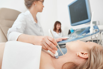 Close up shot of a young woman getting her neck examined by doctor using ultrasound scanner at the modern clinic medicine healthcare professional survey expert doctors concept.