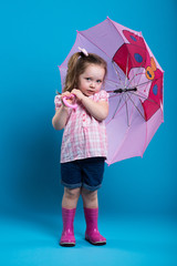 Little girl with pink umbrella
