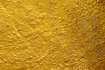 Old gold grunge wall with peeling paint with old concrete