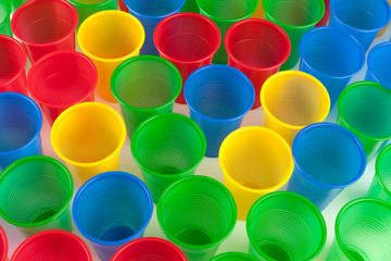 Multicolor plastic glasses isolated on white background