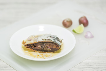 Fish dry fired with lemon and shallot.