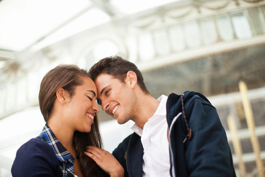 Young couple face to face, smiling