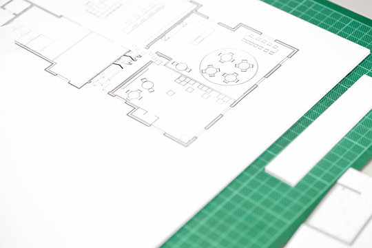 Close up of interior design blueprint on cutting mat