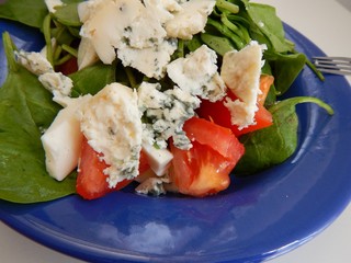 light vegetable salad with spinach tomato and cheese