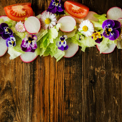 Healthy food. Detox. Organic nutrition. Salad leaves with herbs and flowers