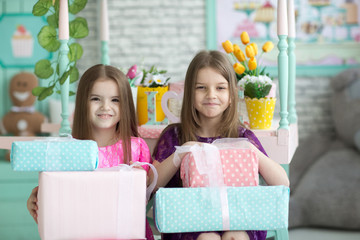 Pretty little girls in dresses on holiday background