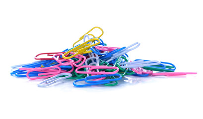 Colored paper clips on a white background