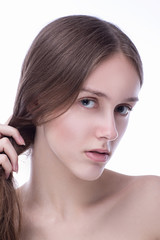 Fototapeta premium Concept of beauty and skin care. Beautiful caucasian woman with perfect looks in the studio on white isolated background, Perfect skin