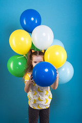 Little girl with baloons