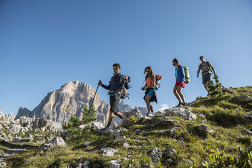 Italy, Friends trekking in the Dolomtes