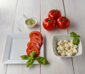 italian appetizer.  tomatoes, basilic and mozarella, olive oil