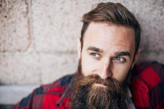Portrait of man with beard looking away