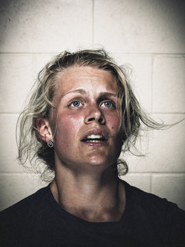 Portrait of exhausted young woman after workout