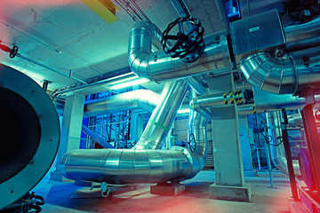 Equipment, cables and piping as found inside of a modern industrial power plant