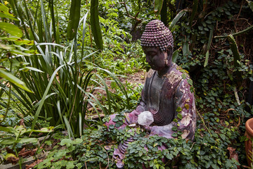 Buddha with crystal in garden