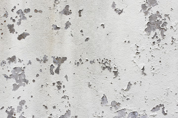 Old white paint on gray concrete wall, for background or texture
