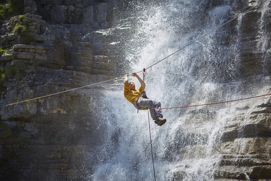 Man rappelling waterfall, Ehrwald, Tyrol, Austria