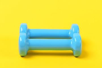 Pair of dumbbells in light blue color