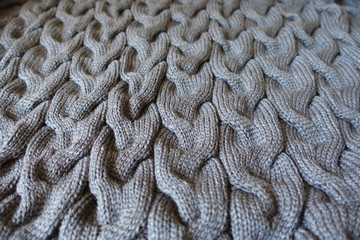 Dark gray knit fabric with braid pattern