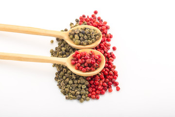 Green and Red Pepper in White Background Wood Spoon