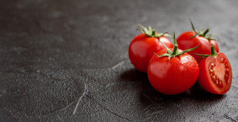 fresh tomato on black background - obrazy, fototapety, plakaty