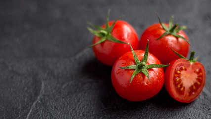 fresh tomato on black background