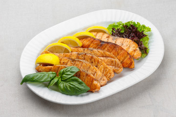 Grilled fish on a white plate