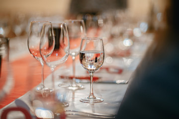 Row of glasses with white wines prepared for tasting