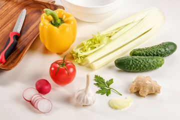 Vegetable salad, vegetarian, pepper, radish, tomato, celery, knife, white background