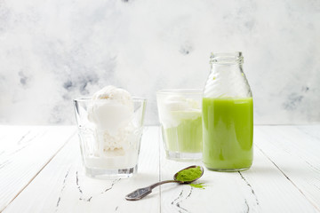 Preparing matcha green tea affogato with vegan coconut ice cream. Copy space