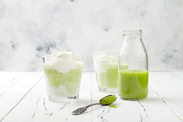 Preparing matcha green tea affogato with vegan coconut ice cream. Copy space