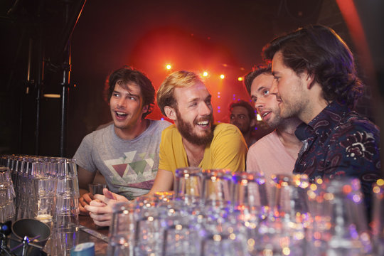 Group of friends celebrating in club