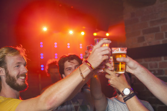 Group of friends celebrating in club