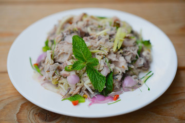 spicy mackerel salad with mix fresh vegetable, thai food.