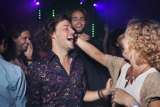 Group of friends celebrating in club